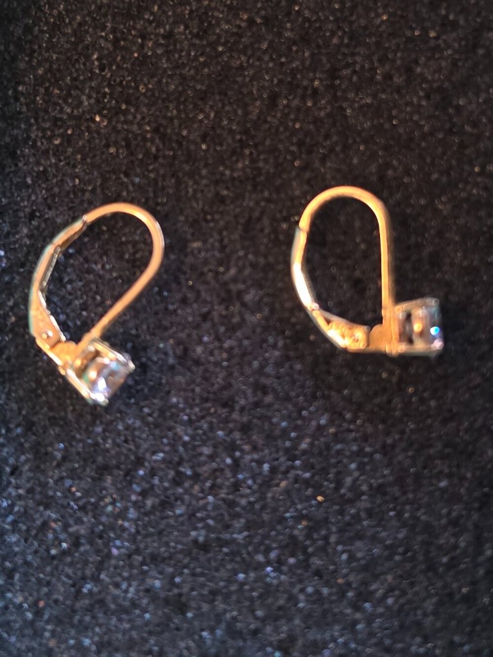Gold tone clasp earrings with clear stone